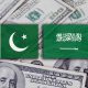 pakistan and saudi arabia flag and dollar currency behind